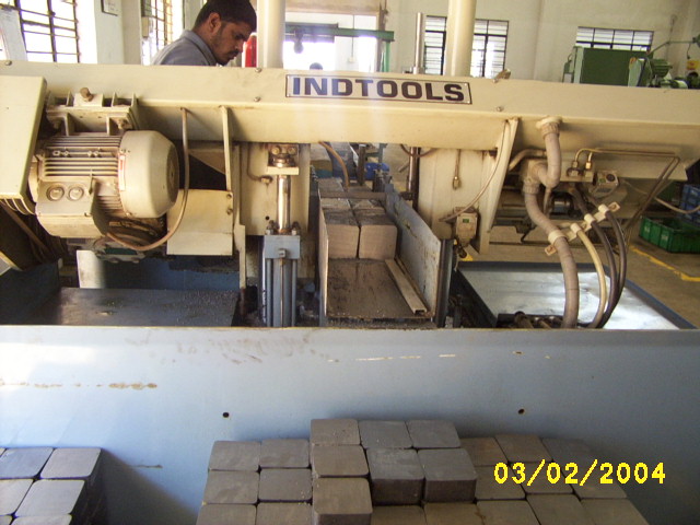 Bandsaw cutting station — ITL · Accurate.
